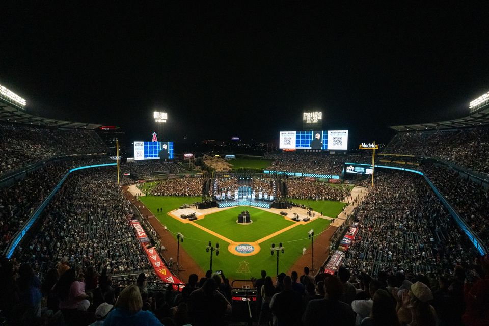 Angel Stadium at night from the upper deck during Harvest Crusade 2025, both outfield LED screens lit