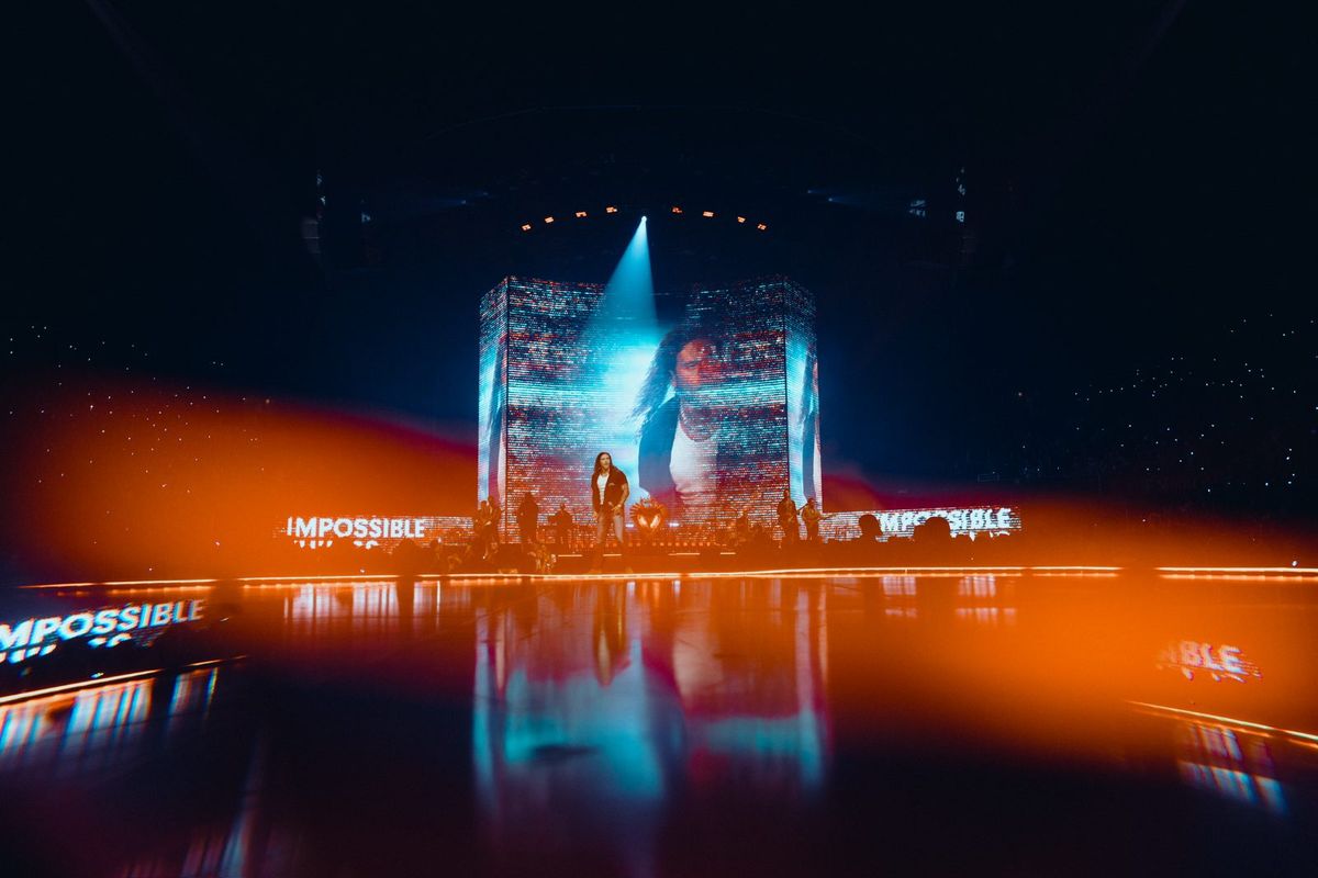 Program frame from the King of Hearts capture — Brandon Lake on the IMAG cube, Impossible across the side walls