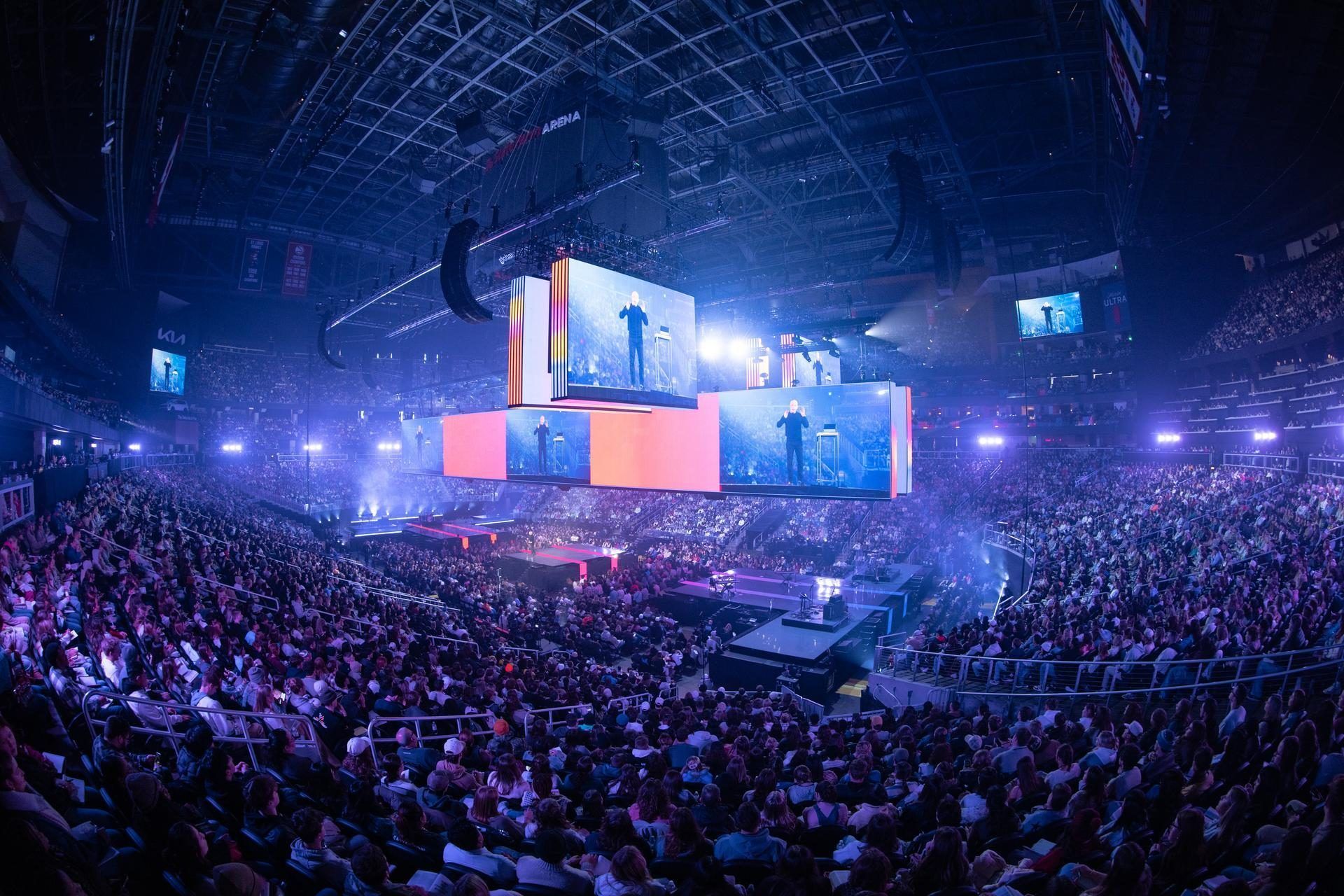 State Farm Arena wide at Passion 2025, the LED lit and the floor full