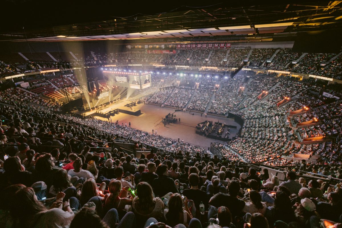 The Moda Center full to the upper deck during PDX Crusade 2025, the stage and screens lit at the far end of the bowl